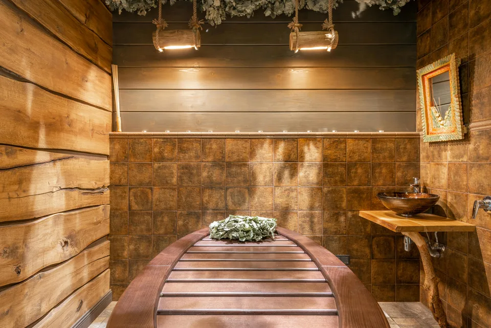 A rustic-style bathroom with natural materials and warm lighting in a calm setting.