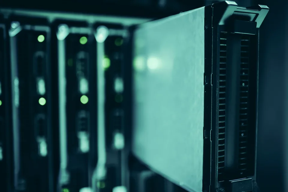 rows of server racks with blinking status lights in a data center aisle
