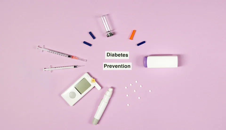 Medical supplies on a pink background with text relating to diabetes prevention.