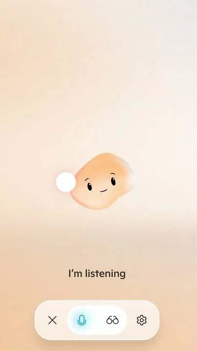 Mico, a peach-colored blob with a smiling face, floating above the words I'm listening in the Copilot voice screen