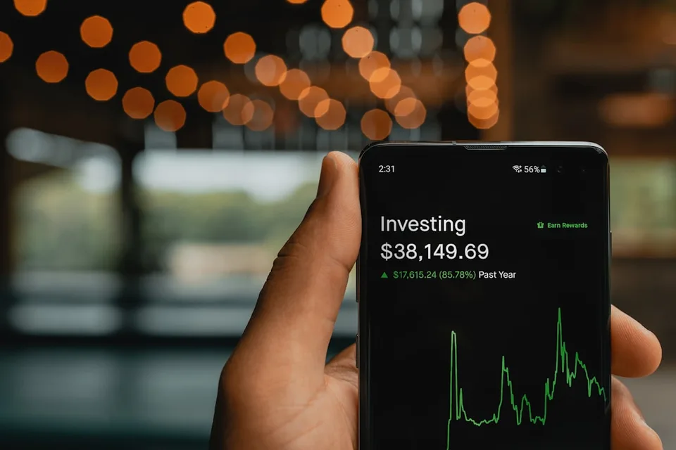a smartphone displaying the Robinhood app for commission-free stock and crypto trading