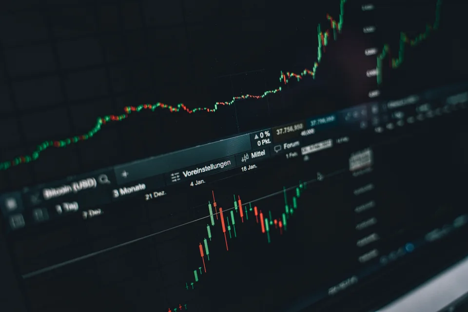 candlestick price chart on a dark trading screen